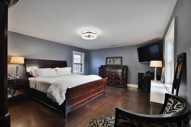 bedroom featuring dark hardwood / wood-style flooring