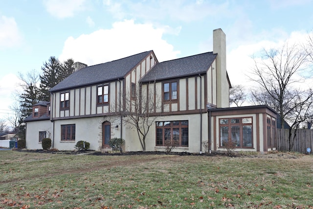 back of house featuring a yard