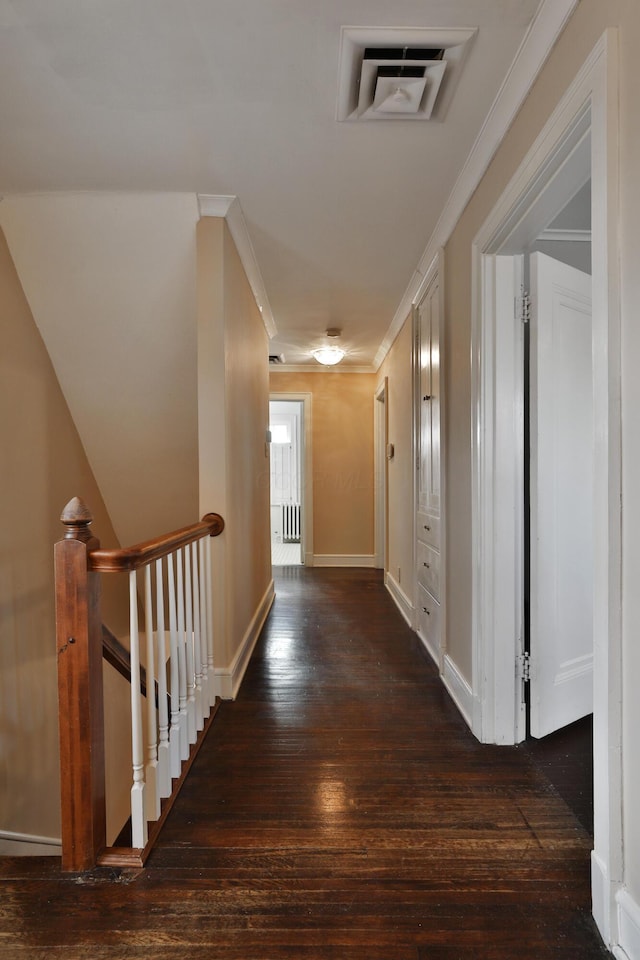 corridor with crown molding and dark hardwood / wood-style floors