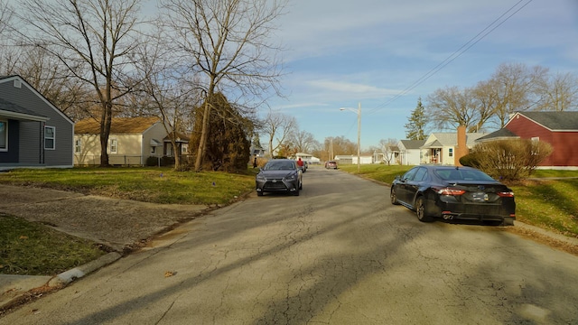 1807 Weiler Ave, Columbus, OH 43207 - view of asphalt street featuring a residential view, street lights, and curbs