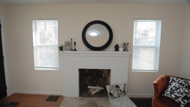 1807 Weiler Ave, Columbus, OH 43207 - living area with healthy amount of natural light, a fireplace, and wood finished floors
