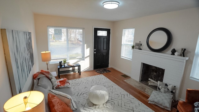 1807 Weiler Ave, Columbus, OH 43207 - foyer with wood finished floors, a fireplace, and baseboards