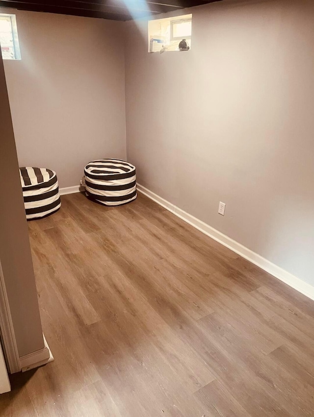 1807 Weiler Ave, Columbus, OH 43207 - below grade area featuring wood finished floors and baseboards