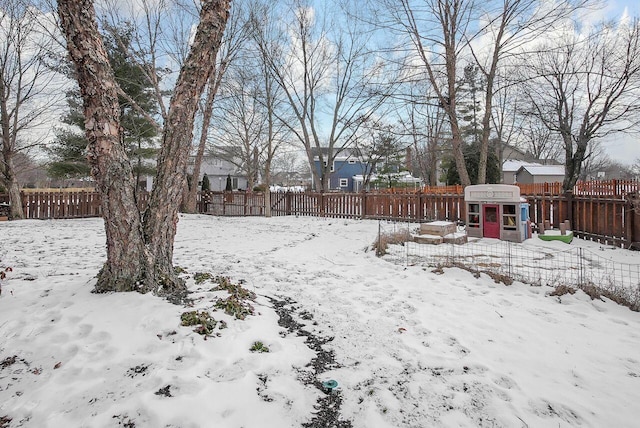 view of yard layered in snow