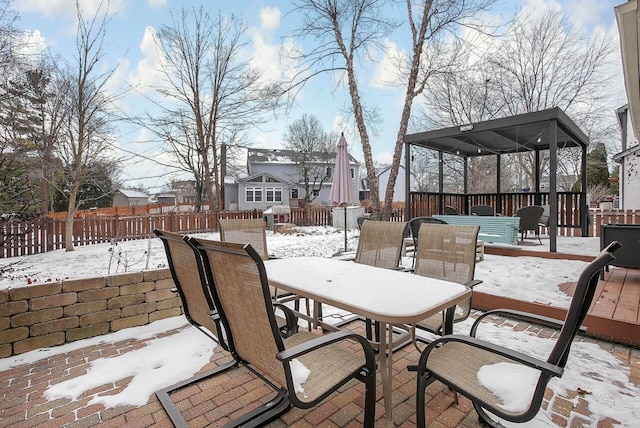 snow covered patio featuring a gazebo