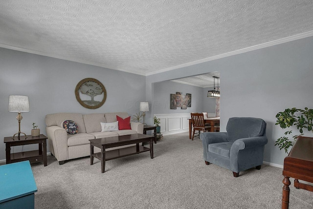 living room with carpet floors and ornamental molding