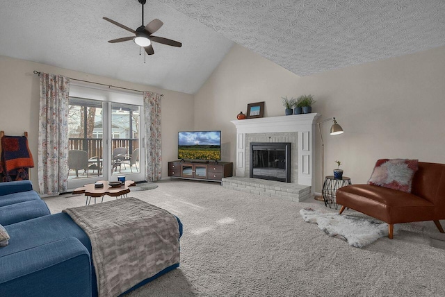 carpeted living room featuring a brick fireplace, a textured ceiling, ceiling fan, and vaulted ceiling