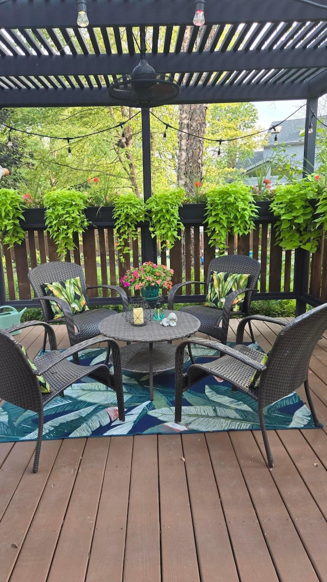 wooden deck with an outdoor living space and a pergola