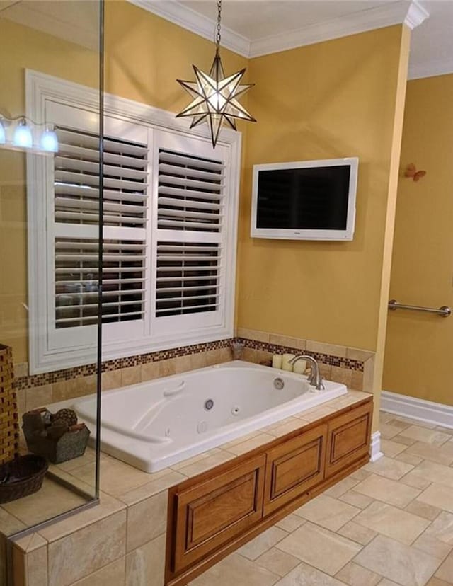 full bath with a tub with jets, baseboards, and ornamental molding