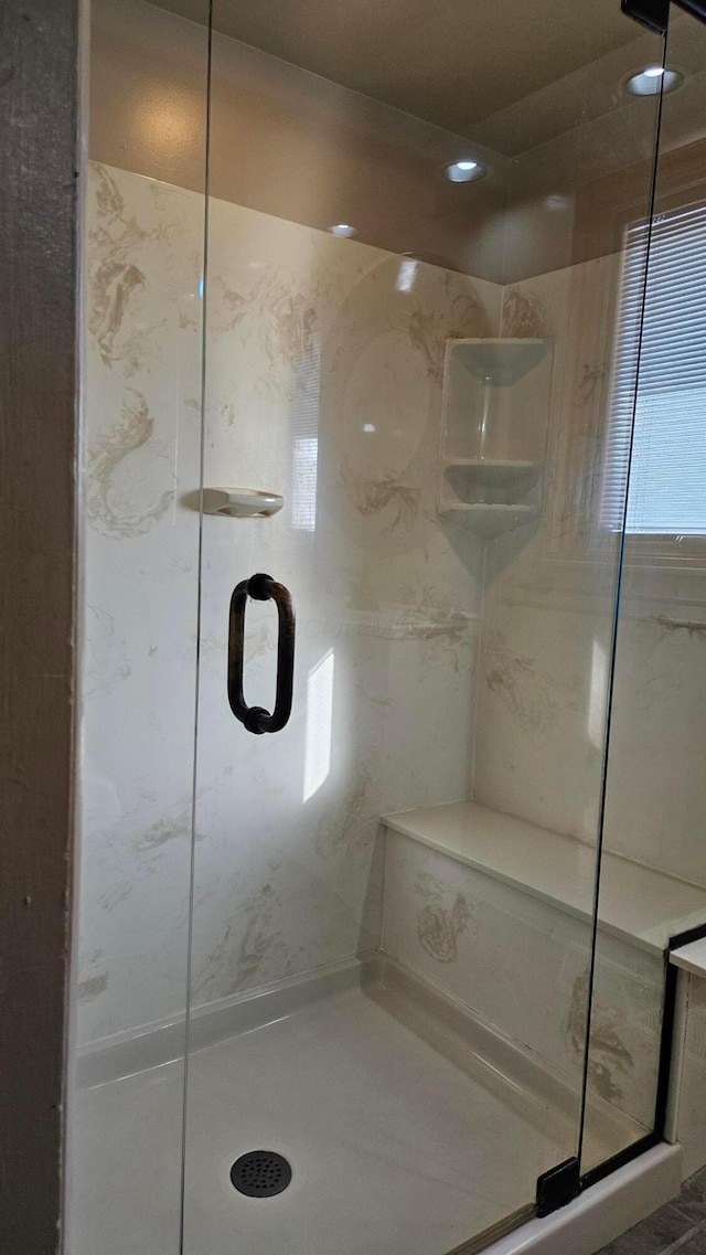 bathroom featuring an enclosed shower