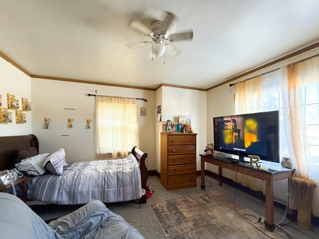 bedroom featuring ceiling fan, crown molding, and carpet floors