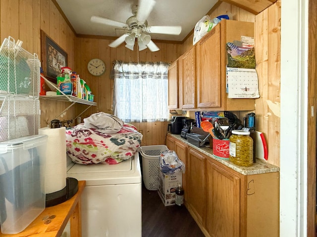 clothes washing area featuring ceiling fan and wood walls