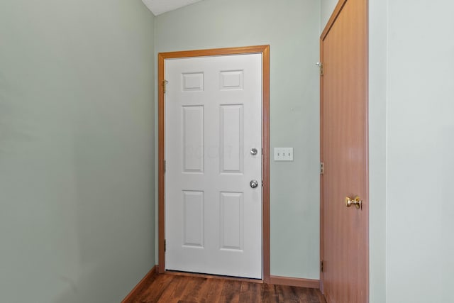 doorway to outside with dark hardwood / wood-style flooring