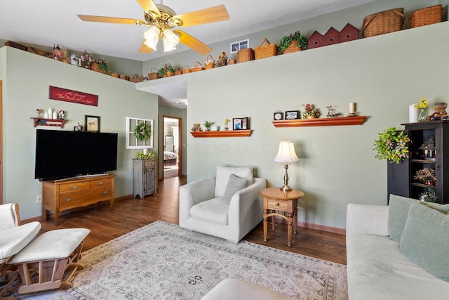 living room with ceiling fan and wood-type flooring