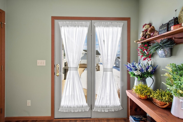 doorway to outside featuring french doors and hardwood / wood-style flooring