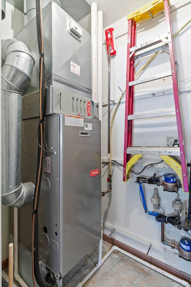 utility room featuring heating unit