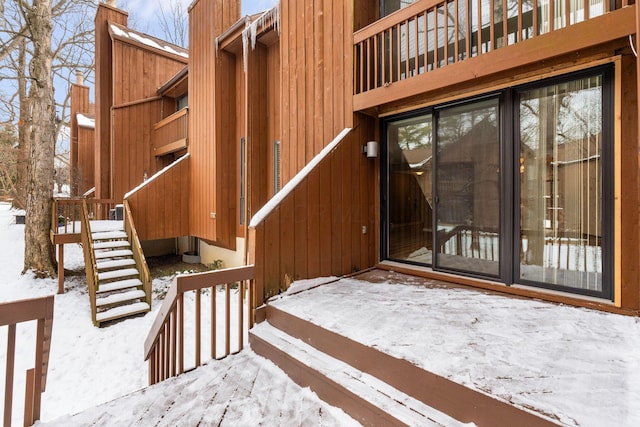 view of snow covered property entrance