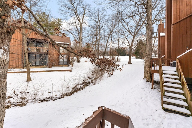 view of yard covered in snow