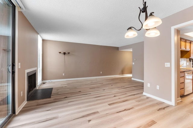 unfurnished living room with light hardwood / wood-style floors