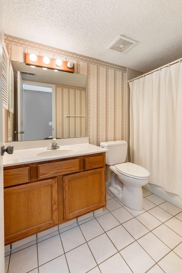 full bathroom with toilet, shower / bath combo, tile patterned floors, a textured ceiling, and vanity