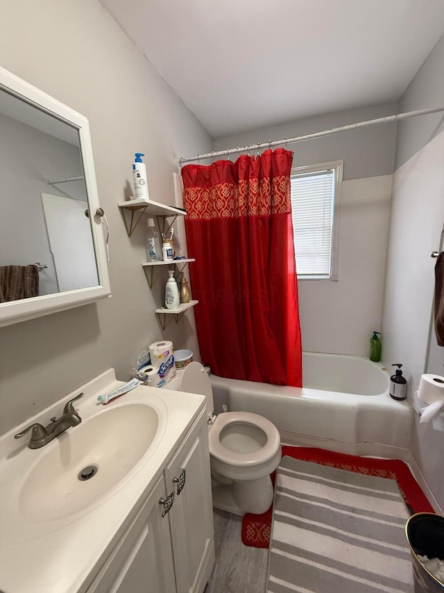 full bathroom with vanity, toilet, shower / bath combo with shower curtain, and wood-type flooring