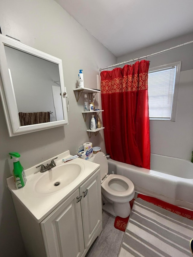 full bathroom with shower / tub combo, hardwood / wood-style flooring, vanity, and toilet