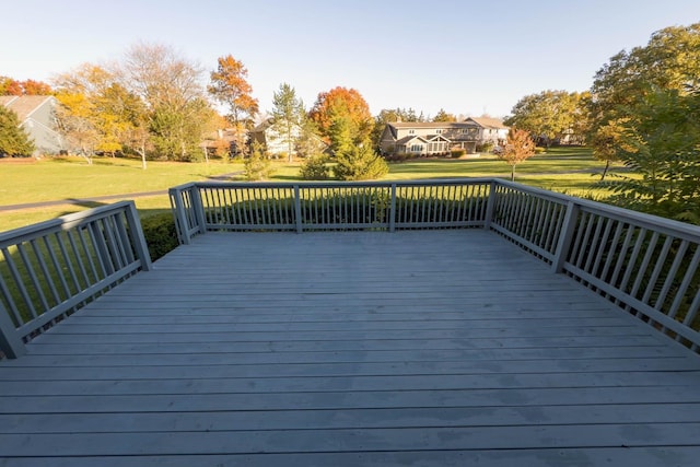 wooden deck featuring a yard