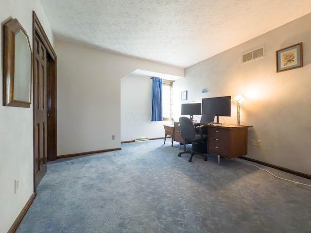 home office with a textured ceiling