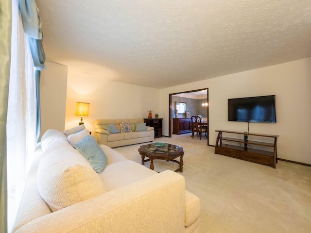 living room with carpet flooring and a textured ceiling