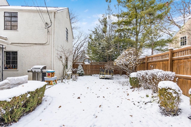 view of yard covered in snow