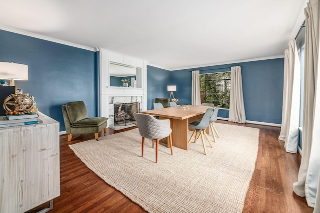 dining space featuring crown molding and dark wood-type flooring