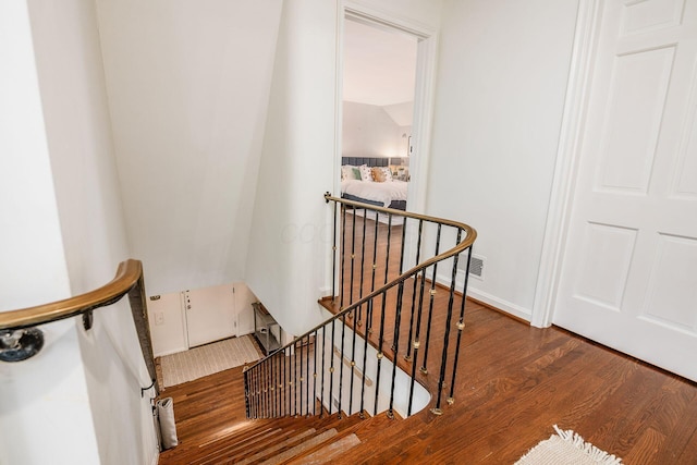 stairway with wood-type flooring