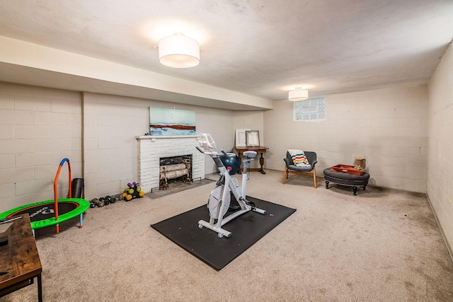 exercise area with a fireplace