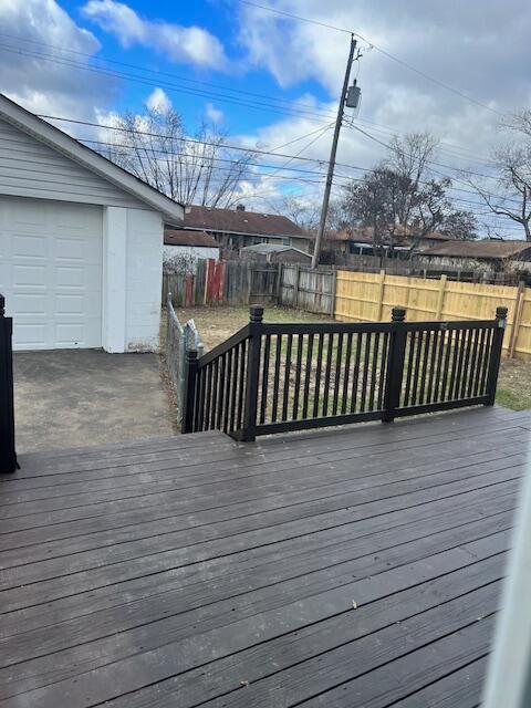 wooden deck with a garage