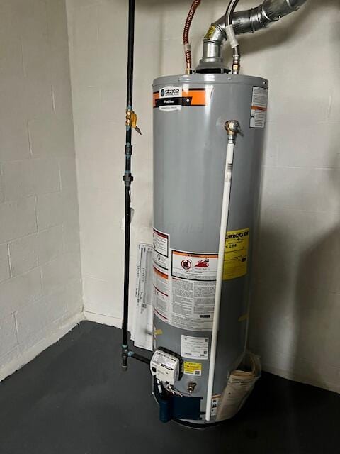 utility room with water heater