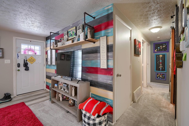 interior space with visible vents and a textured ceiling