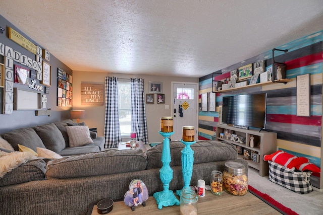 carpeted living room featuring a textured ceiling