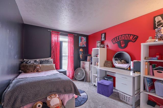 bedroom featuring carpet and a textured ceiling