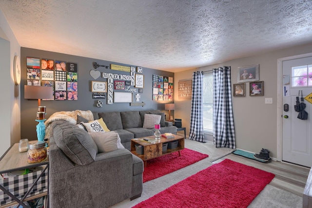 living room with baseboards and a textured ceiling