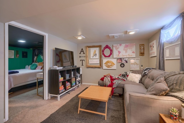 living area featuring baseboards and carpet floors