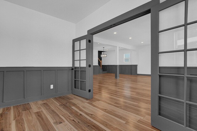 262 N 17th St, Columbus, OH 43203 - empty room with a notable chandelier and light hardwood / wood-style floors