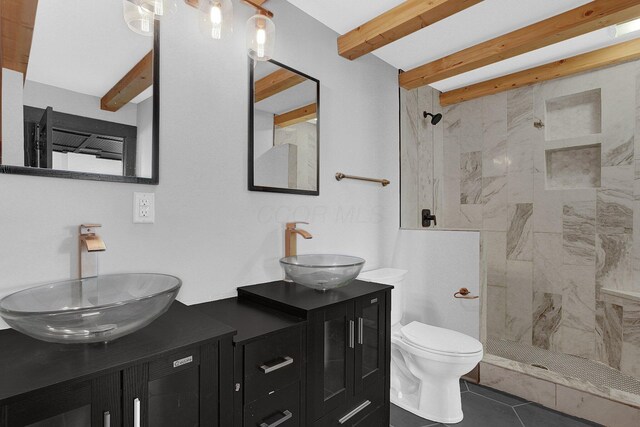 262 N 17th St, Columbus, OH 43203 - bathroom with toilet, a tile shower, tile patterned floors, beamed ceiling, and vanity