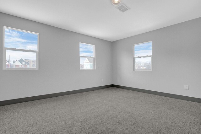 262 N 17th St, Columbus, OH 43203 - unfurnished room featuring plenty of natural light and carpet flooring
