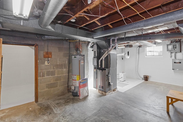 basement featuring heating unit, electric panel, and gas water heater