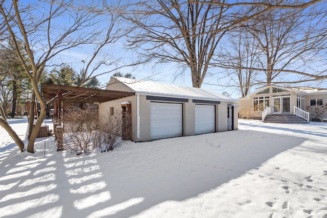 view of snow covered garage