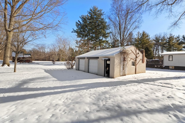 view of snow covered garage