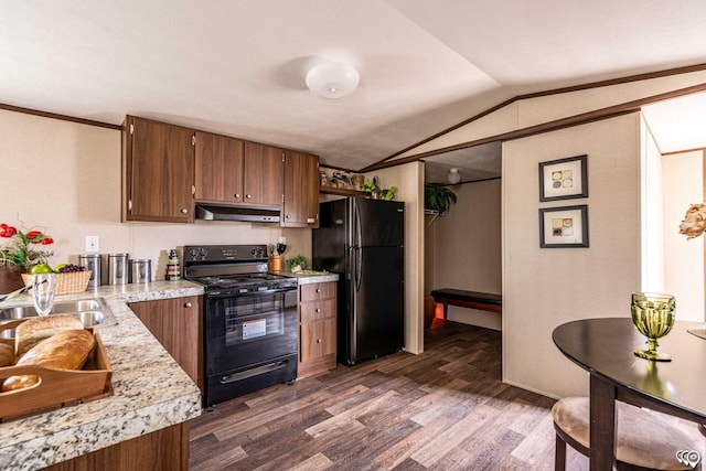 kitchen with vaulted ceiling, dark wood-type flooring, sink, and black appliances