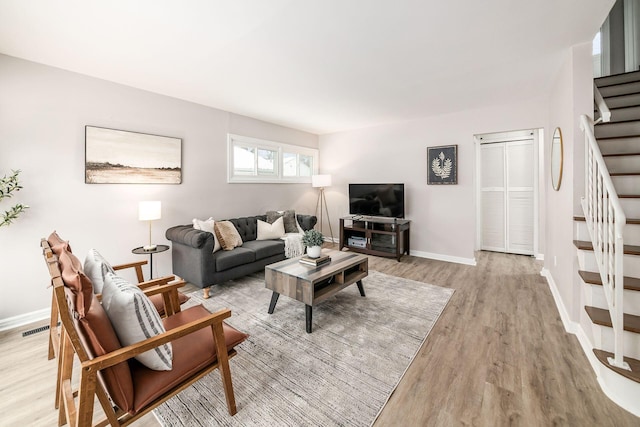 living room with light hardwood / wood-style floors