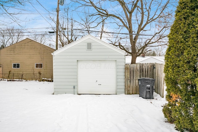 view of snow covered garage