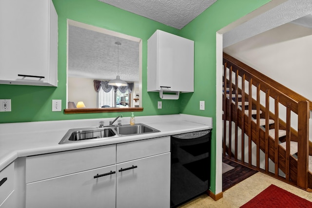 kitchen with white cabinets, a textured ceiling, dishwasher, and sink